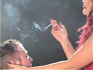 ginger-haired bi-atch dominates a man while smoking