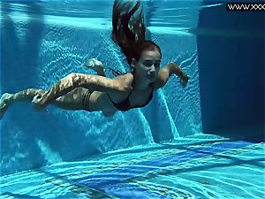 Tiffany Tatum unwraps naked underwater